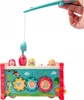 A child's toy with pop-up characters and gears, being held by a hand with a fishing rod. Podgląd zdjęcia produktu