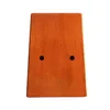 A top-down view of a wooden kalimba on a white background. Produktbild-Vorschau