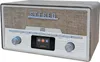 A retro-style stereo system with a wood-grain finish, fabric speaker grille, and a digital display. Náhľad obrázku produktu