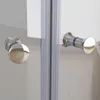 Close-up view of two chrome shower door handles on a glass shower enclosure. Produktbild-Vorschau