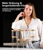 A woman is standing behind a display of glass storage jars with bamboo lids. Anteprima dell’immagine prodotto