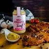 A jar of mustard and sliced meat on a wooden board. Produktbild-Vorschau