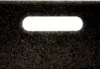 A close-up view of a dark, speckled surface with a bright, illuminated oval cutout. Podgląd zdjęcia produktu
