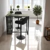 A bar table and two stools are set up in a bright, modern room with large windows. Produktbild-Vorschau