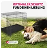 A woman hugging a dog in a grassy area, with a dog crate in the background. Produktbild-Vorschau