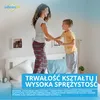 A mother and son jumping on a bed. There is promotional text overlayed on the image. Podgląd zdjęcia produktu