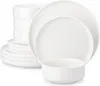 A stack of white ceramic plates and bowls. Produktbild-Vorschau