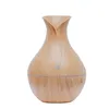 A product shot of a humidifier with a wood grain finish. Produktbild-Vorschau