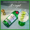 A bottle of Tanqueray London Dry Gin and a gin and tonic cocktail are displayed on a marble surface, with a jigger in the background. Produktbild-Vorschau