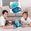 Two young boys are playing a board game on the floor in front of a couch. Produktbild-Vorschau
