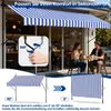 A couple sitting at a table outside a cafe with a blue and white striped awning. Náhled obrázku produktu