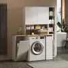 A modern laundry room with a washing machine, storage cabinets, and a laundry basket. Voir les images du produit