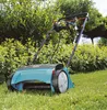 A lawn scarifier is shown in a garden setting. Produktbild-Vorschau