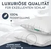 A close-up view of two white pillows, with text overlays highlighting product features. Produktbild-Vorschau