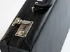 A close-up shot of a black briefcase with a combination lock. Produktbild-Vorschau
