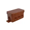 A brown electrical junction box with multiple circular knockouts and a mounting bracket is shown against a white background. Podgląd zdjęcia produktu