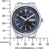 A close-up of a men's wristwatch with a blue dial, placed next to a ruler for size reference. Náhled obrázku produktu