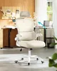 An office chair in a home office setting with a desk and corkboard in the background. Produktbild-Vorschau