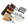 A collection of leather crafting tools laid out on a white background. Voir les images du produit