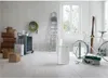 A storage room or garage with various items including boxes, a ladder, a bicycle, and a dehumidifier. Voir les images du produit
