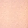 A close-up, textured view of a light peach-colored surface. Produktbild-Vorschau