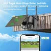 A solar-powered security camera mounted on a wooden structure, with a smartphone displaying a live feed of cows in a field. Náhled obrázku produktu