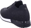 A black sneaker with a white sole, shown from the side and slightly from the back. Voir les images du produit