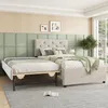 A bedroom scene featuring a beige upholstered bed with a pull-out trundle bed. Anteprima dell’immagine prodotto