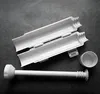 A white sushi-making tool set is laid out on a dark gray surface. Náhled obrázku produktu