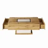 A modern coffee table with drawers and a glass insert. Produktbild-Vorschau