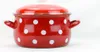 A red enamel pot with white polka dots is shown against a white background. Anteprima dell’immagine prodotto