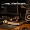 A desk setup with audio equipment, including a computer monitor, speakers, and an amplifier with vacuum tubes. Produktbild-Vorschau