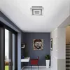 A modern hallway with a desk, chair, and artwork. Produktbild-Vorschau