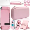 A collection of pink accessories for a Nintendo Switch. Produktbild-Vorschau
