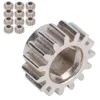 A group of small metal gears and one larger gear shown against a white background. Náhľad obrázku produktu