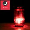 A red LED solar grave light is shown in a dark setting, with a red glow emanating from it. A graphic overlay in the top left corner shows a crescent moon and the text 'Bei Nacht'. Produktbild-Vorschau