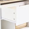 A close-up view of an open drawer on a white cabinet, showing the drawer slides and the interior of the drawer. Podgląd zdjęcia produktu