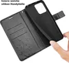 A hand is holding a black phone case, showing its interior and the wallet-like exterior. Produktbild-Vorschau