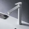 A white faucet is shown on a white sink next to a smartphone. Produktbild-Vorschau