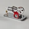 A chrome and red Stirling engine model with a glass fuel bottle and wick, set against a plain background. Náhľad obrázku produktu