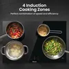 A close-up overhead view of a black induction cooktop with four pots and pans cooking food. Náhľad obrázku produktu