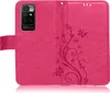 A pink flip case for a smartphone, decorated with a floral and butterfly pattern. Produktbild-Vorschau