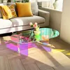 A modern living room scene with a couch, pillows, and an iridescent coffee table. Anteprima dell’immagine prodotto