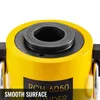 Close-up view of the top of a yellow hydraulic cylinder with a black central component. Podgląd zdjęcia produktu