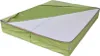 A folded mattress with a green cover partially opened to reveal the white foam interior. Produktbild-Vorschau