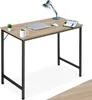 A desk with a laptop, mouse, lamp, and mug. Produktbild-Vorschau