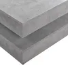 A close-up view of two stacked concrete-look surfaces, likely a coffee table. Náhled obrázku produktu