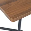 A close-up view of the edge of a wooden table with a dark metal leg. Podgląd zdjęcia produktu