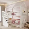 A white bunk bed with a house-shaped frame, complete with stairs and storage shelves, is shown in a child's bedroom. Anteprima dell’immagine prodotto