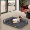 A dog is resting on a dog bed in a living room setting, with a patio visible through sliding glass doors. Náhľad obrázku produktu